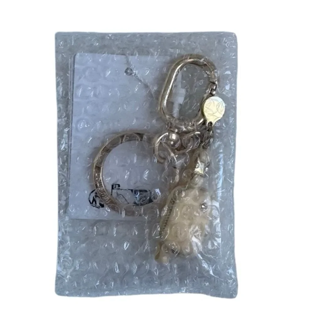 Everywhere Belt Bag Key Charm Butter Cream/Gold Key Charm
